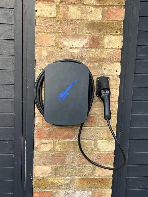 Hypervolt EV charger with tethered cable on a brick pier, Fritwell near Bicester