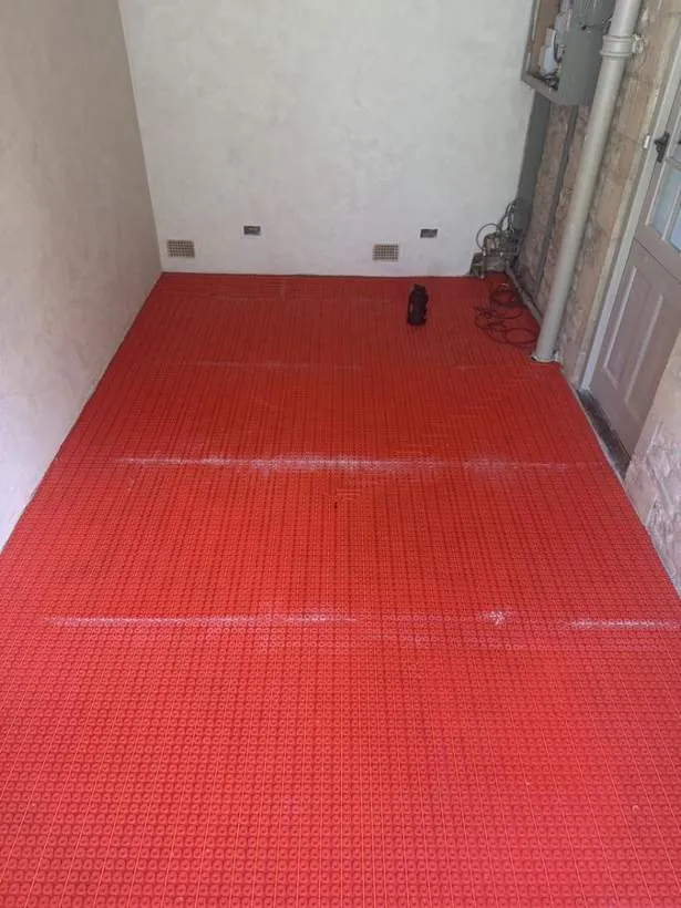 Electric underfloor heating laid across a room ready for the floor finish, period property in Charlbury