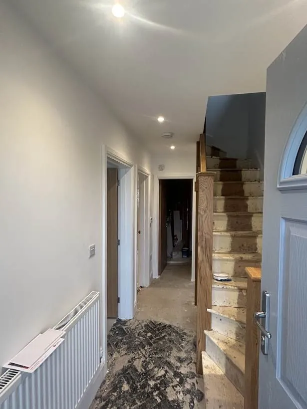 Hallway with recessed downlights, smoke detector and new switches while flooring and stairs are still being finished, Oxford