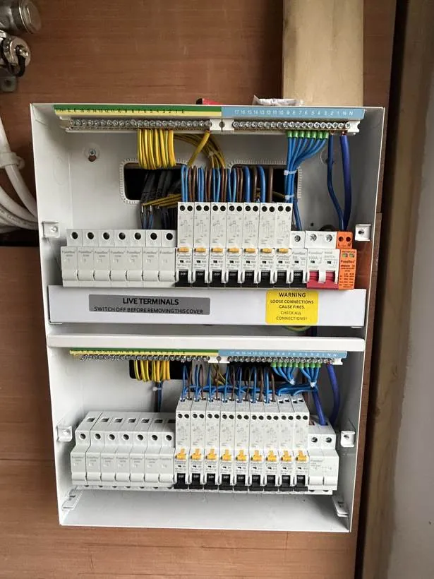 Two consumer units with RCBO and surge protection, photographed during installation before final dressing and covers, village near Bicester