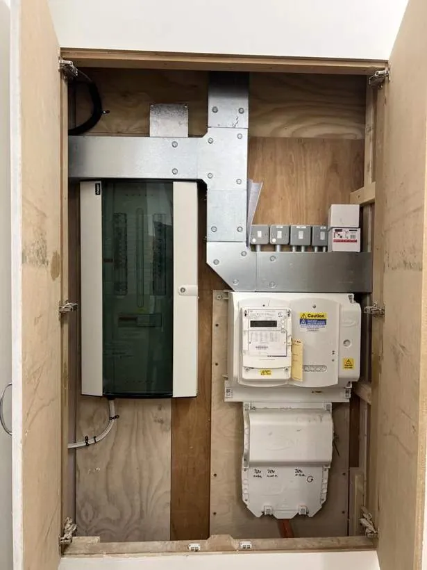New distribution board, isolators and meter installed in a cupboard for a retail store in Oxford