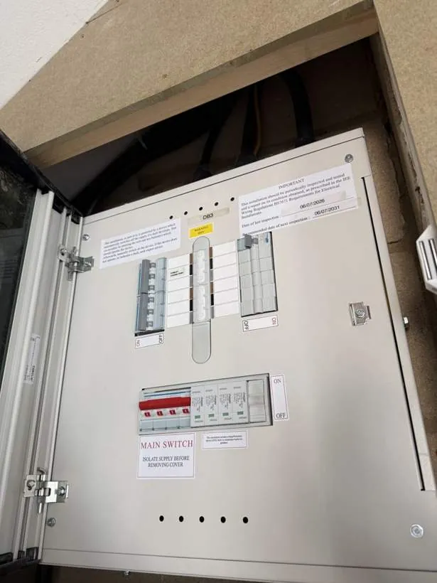 Large commercial distribution board with labelled main switch and new protective devices, installed after an EICR in Bicester