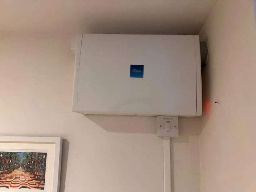 Wall-mounted positive input ventilation unit with boost controller, installed to tackle condensation and mould, Banbury