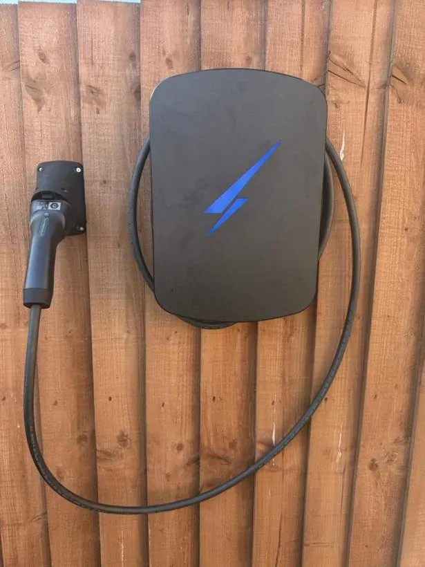 Hypervolt EV charger with tethered cable mounted at a residential parking space, Milton Keynes