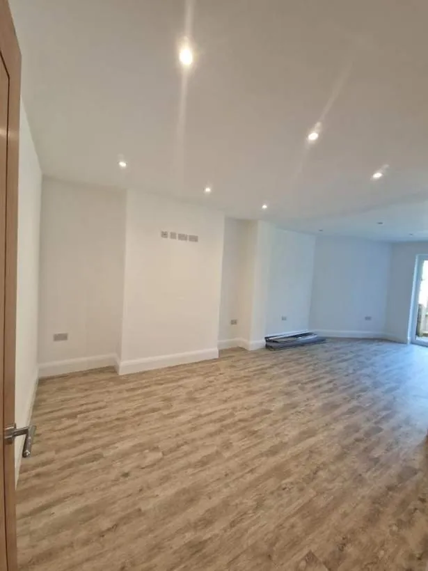 Large newly finished room with recessed downlights and new sockets, part of a full rewire and extension, Oxford
