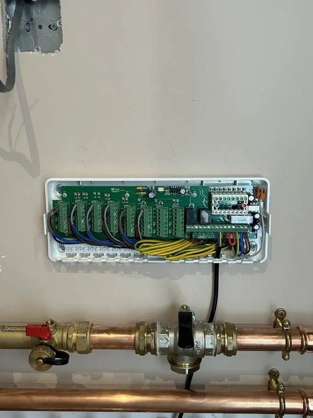 Underfloor heating wiring centre with zone connections above the heating pipework, Marcham near Abingdon