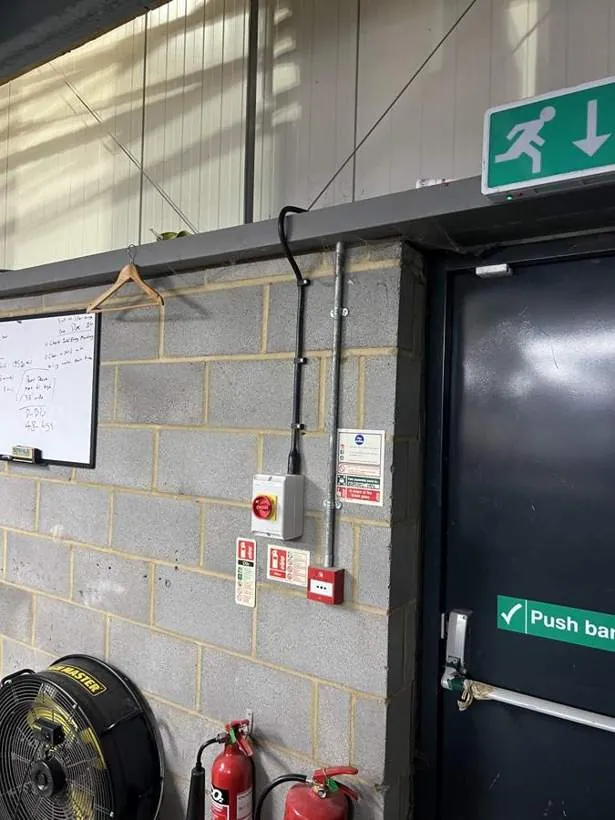 Isolators and supply cabling for a second high-output heater on a blockwork wall in a commercial unit, Oxford