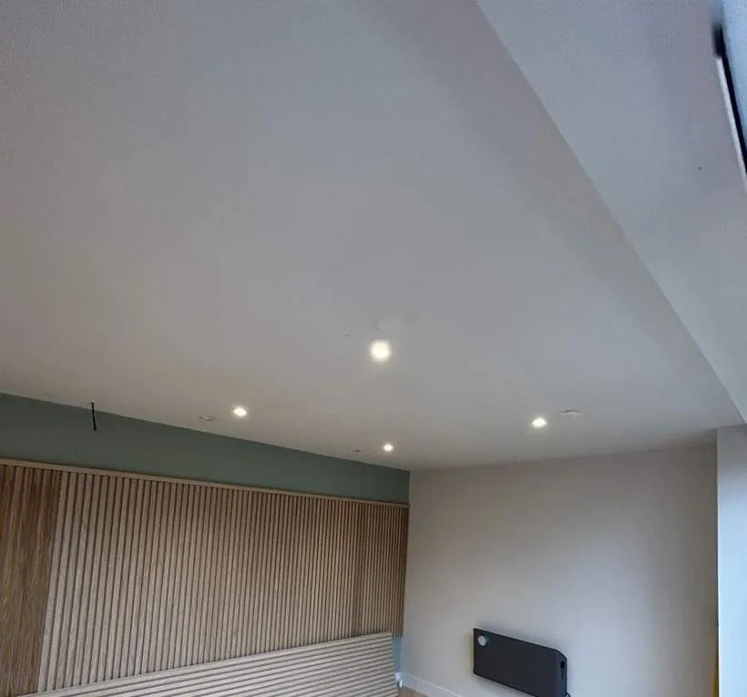 Wall-mounted electric panel heater and downlights in a converted garage, Watlington, Oxfordshire