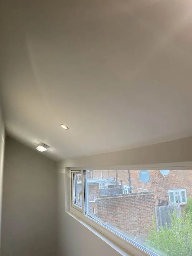 HMO bedroom ceiling with recessed downlights above a wide window, Feltham