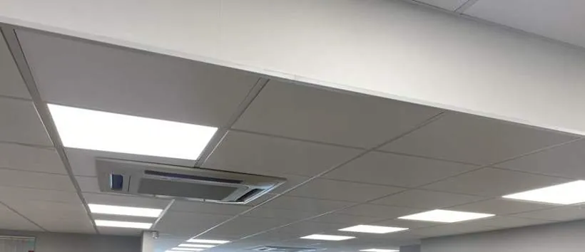 Office suspended ceiling with new 600 by 600 LED panels and replacement ceiling tiles, Bicester