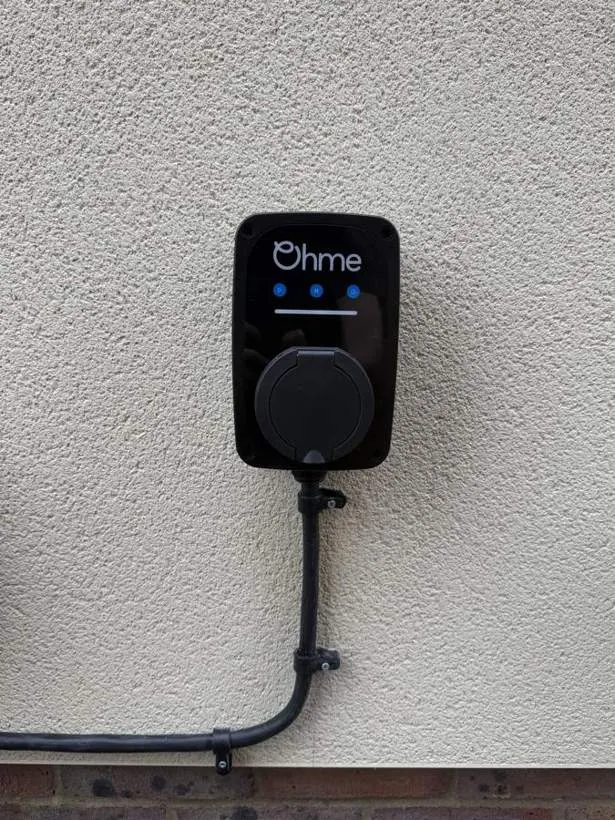 Ohme home EV charger with neat conduit run on a rendered wall, Heyford near Bicester